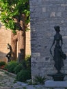 An old croatian town is decorated with the emotional statues