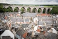 Old croft houses in Cullen, fishing village on Moray Firth, Scotland. Cullen Viaduct in the background, old roofs and chimneys Royalty Free Stock Photo