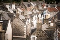 Old croft houses in Cullen, fishing village on Moray Firth, Scotland. Cullen Viaduct in the background, old roofs and chimneys Royalty Free Stock Photo