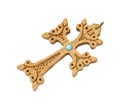 Old cross of carved wood decorated with turquoise