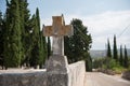 Old cross on a graveyard wall. Cross made out of stone Royalty Free Stock Photo