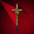 Old Cross With Jesus on Red Velvet Royalty Free Stock Photo