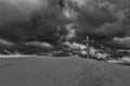 An old cross on sand dune next to the ocean with a calm sunrise Royalty Free Stock Photo