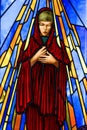 Old Crow, Canada. Colourful church window depicting a Saint.