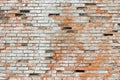 Crumbling brick wall made of ceramic red brick