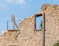 Old crumbling building in Elora Ontario, blue sky, window frames Royalty Free Stock Photo