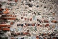 Old crumbling masonry wall with red bricks and stones.Old red brick wall, grunge background Royalty Free Stock Photo