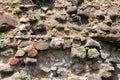 Old crumbling masonry wall with red bricks and stones.Old red brick wall, grunge background Royalty Free Stock Photo