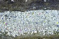 Crumbling paint from concrete wall, abstract background