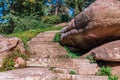 Old curved staircase with stone steps carved into the rock Royalty Free Stock Photo