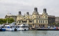 Old customs building and many moored pleasure boats of the Port Vell, Barcelona Royalty Free Stock Photo