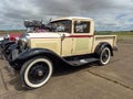 Old cyan Ford Model A pickup truck cargo utility circa 1930. Front left view. Classic car show.