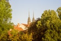 Old czech town Brno through green trees with gradient treatment