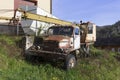 Old Czechoslovak abandoned truck parking in the grass. Vehicle is rusty, tarnished and corroded.