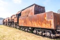Old Czechoslovakian CSD steam engine on graveyard, rusty