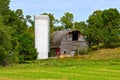 Old dairy barn and silo abandoned and left to deteriorate