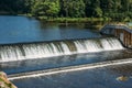 Old dam at ancient hydroelectric power station, water flows Royalty Free Stock Photo