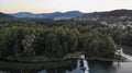 Old dam of water power plant with tributary of river Aare in riparian forest in Brugg, Switzerland