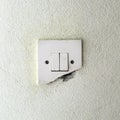 Old damage light switch on white wall Royalty Free Stock Photo