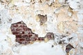 Old damaged brick wall and plaster, texture background. Royalty Free Stock Photo