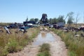 Old damaged cars in the junkyard. Car graveyard Royalty Free Stock Photo