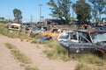 Old damaged cars in the junkyard. Car graveyard Royalty Free Stock Photo