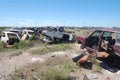 Old damaged cars in the junkyard. Car graveyard Royalty Free Stock Photo