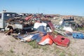 Old damaged cars in the junkyard. Car graveyard