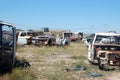 Old damaged cars in the junkyard. Car graveyard Royalty Free Stock Photo