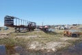 Old damaged cars in the junkyard. Car graveyard