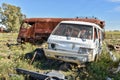 Old damaged cars in the junkyard. Car graveyard Royalty Free Stock Photo