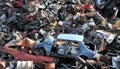 Old damaged cars on the junkyard waiting for recycling