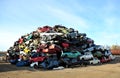 Old damaged cars on the junkyard waiting for recycling.