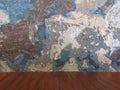 Old damaged color grunge wall and wooden table.