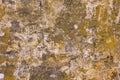 Old damaged gray concrete wall with stains of yellow, red and black paint. rough surface texture Royalty Free Stock Photo