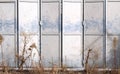 Metal gray folding door on an abandoned warehouse