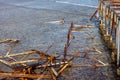Old damaged pier garbage in water Royalty Free Stock Photo