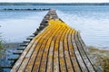 Old damaged pier by seaside