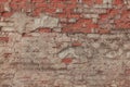 Old damaged red brick wall close up. Grunge house facade. Abstract texture background. Horizontal brick tile background. Royalty Free Stock Photo