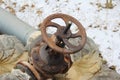 Old damaged and rusty iron oil pipe valve wheel. Metal, pipeline and mechanic concept. An old iron valve on a gas pipe. A valve to Royalty Free Stock Photo