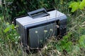 Old Damaged Tube Television Illegally Dumped On A Meadow Endangering Nature With Hazardous Substances Royalty Free Stock Photo