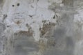 Old damaged wall background textere. Fragile plaster fragments, scratches, cracks, roughness. Design backdrop concept Copy space Royalty Free Stock Photo