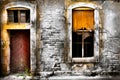 Old damaged wall with barred window and a door Royalty Free Stock Photo