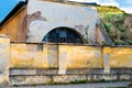 Old damaged wall with a barred window Royalty Free Stock Photo