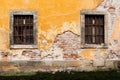 Old damaged wall with barred windows 3 Royalty Free Stock Photo