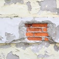 Old damaged wall with plaster peeling off