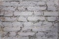 Old damaged white brick wall. rough surface texture Royalty Free Stock Photo