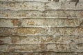 A old damaged white gray brick wall with cracks. rough surface texture. spots of dirt and cement on the wall. horizontal lines