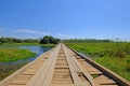 Old damaged wooden bridge on the transpantaneira dirt road with Pantanal wetland, Porto Jofre, Mato Grosso, Brazil