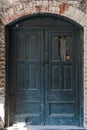 Old Damaged Wooden Doors with Brick Royalty Free Stock Photo